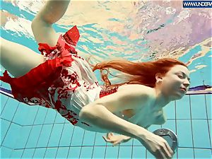 torrid polish red-haired swimming in the pool